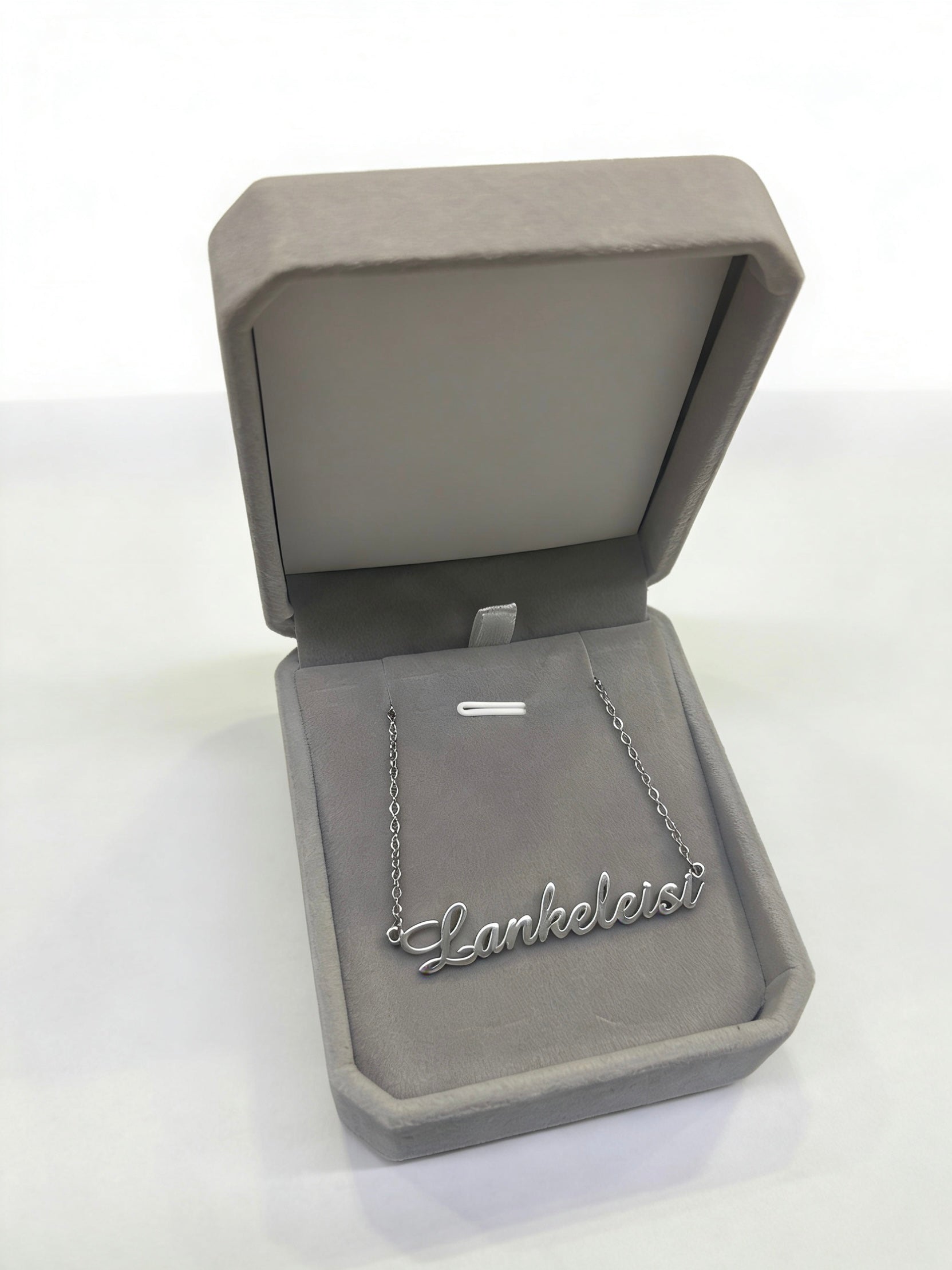 LANKELEISI Exclusive necklace featuring intricate silver chain and pendant, stylish jewelry accessory on a neutral background.